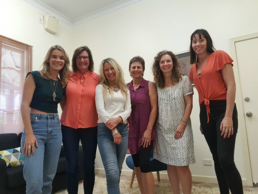 row of women ambassadors smiling at camera